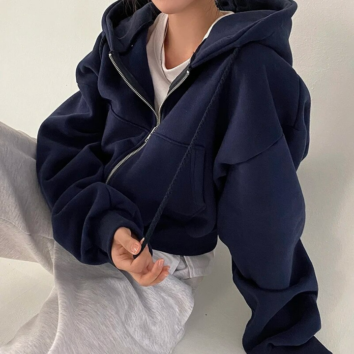 Modieuze oversized dameshoodie met rits. Comfortabel sweatshirt voor een relaxte, trendy look.