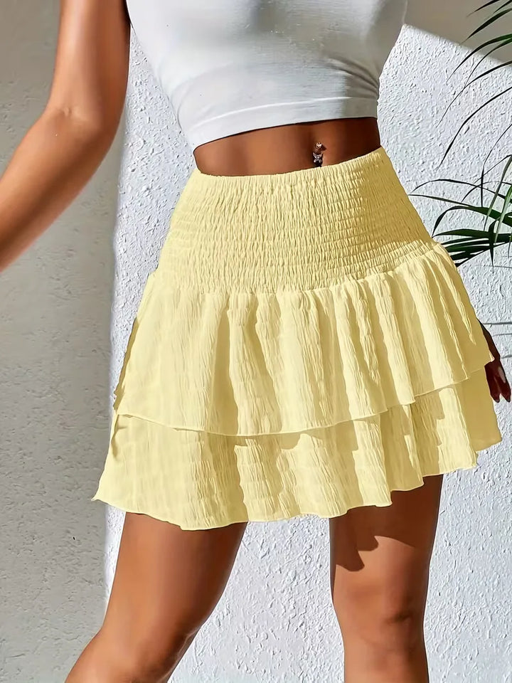 Dames plooirok met flounce, perfect voor een zomerse, stijlvolle look. Lichtgewicht en comfortabel.