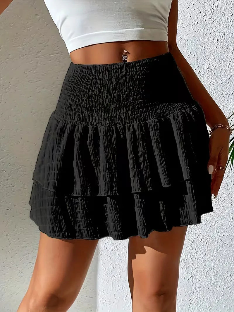 Zomerse dames plooirok met flounce en gesmokte taille, perfect voor een comfortabele, trendy look.