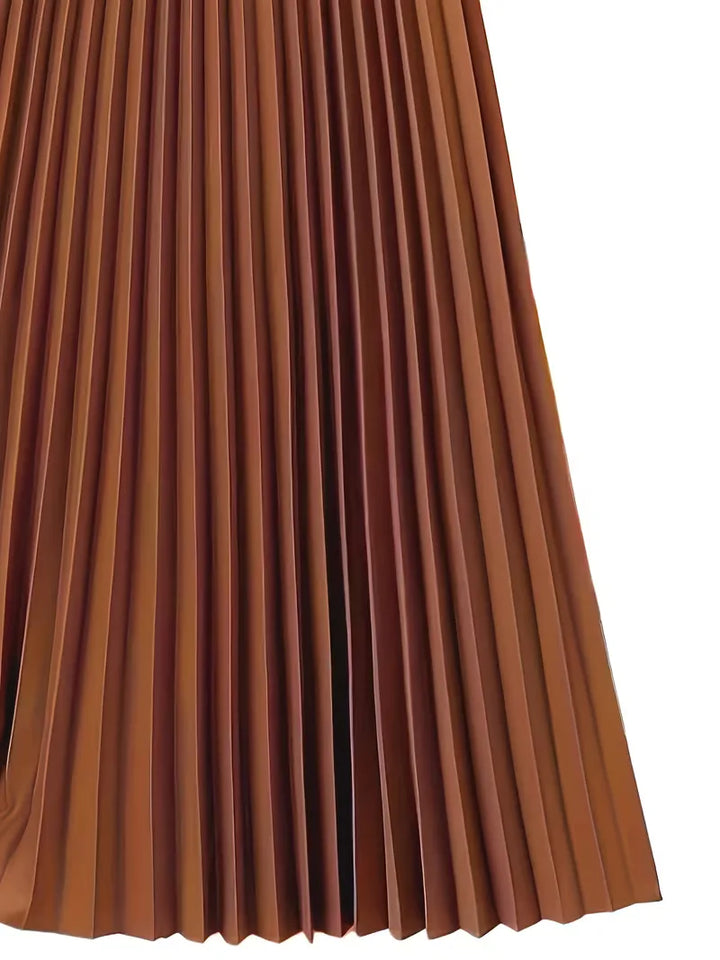 Deze veelzijdige dames plooirok met hoge taille is draagbaar van zakelijk tot feestelijk. Elegant en comfortabel.