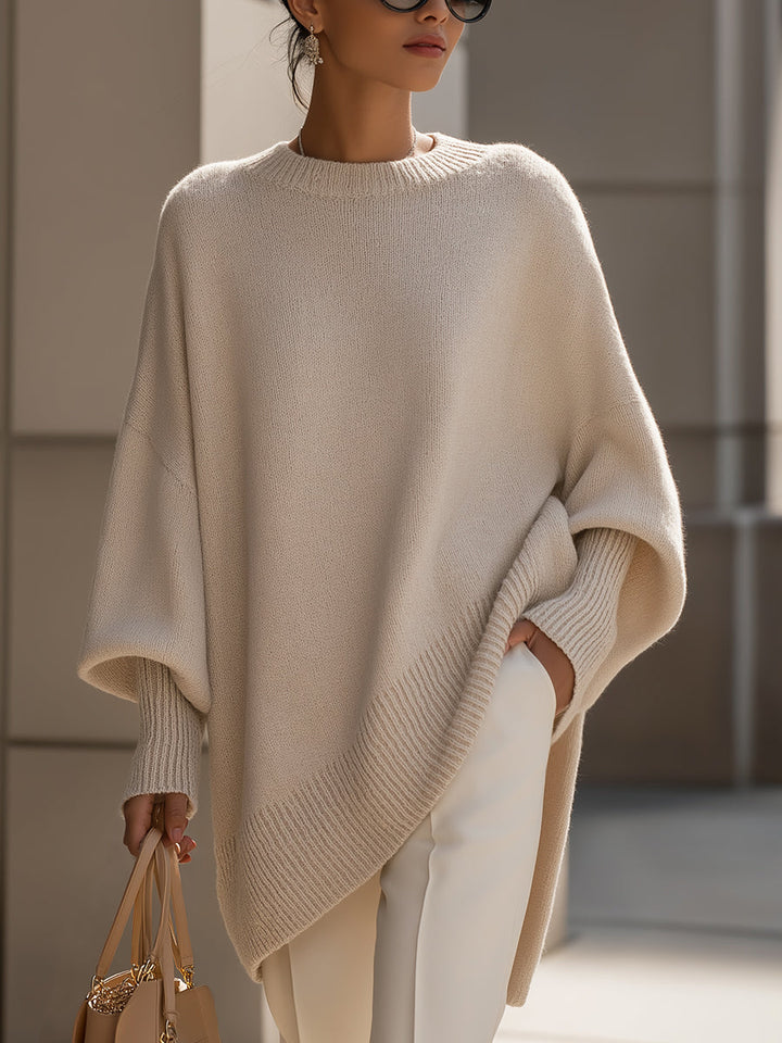 Dames poncho-pullover met asymmetrische zoom, perfect voor een comfortabele en stijlvolle herfstlook.