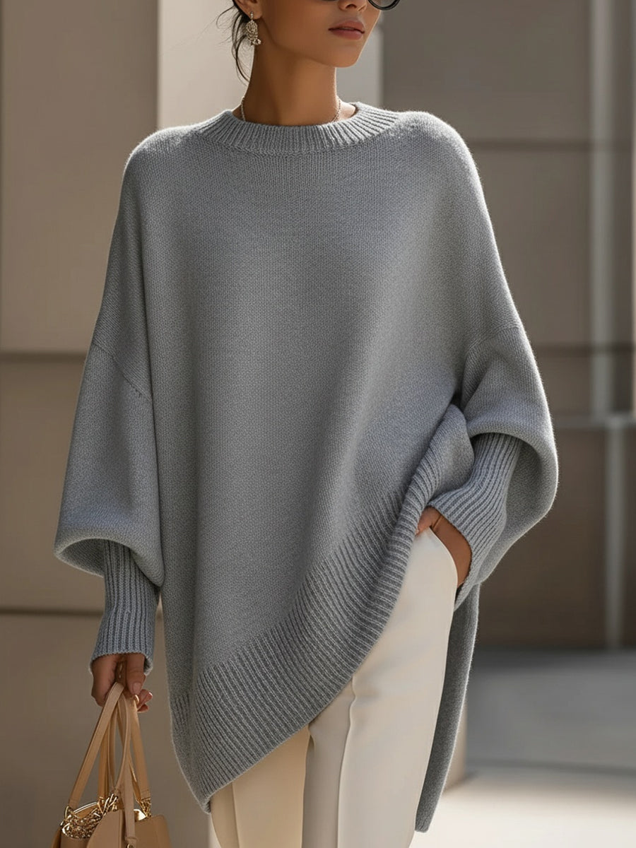 Trendy dames poncho-pullover met asymmetrische zoom, een must-have voor een stijlvolle en warme winteroutfit.