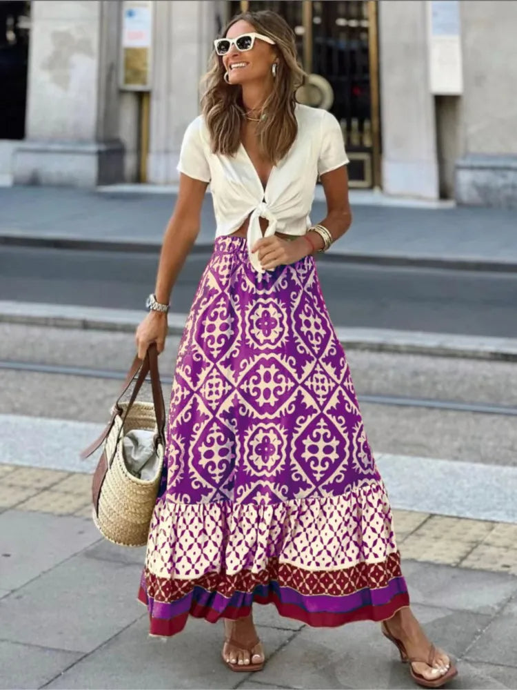 Vintage stijl dames midi rok met levendige retro print en speelse ruches; perfect voor casual dagen.