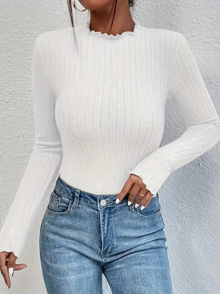 Ribstof dames longsleeve, effen kleur met mock halslijn en verfijnde ruches, eenvoudig te stylen.