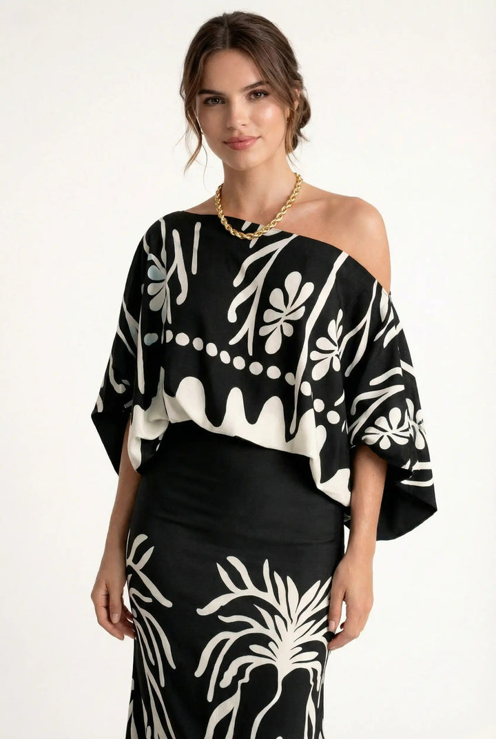 Comfortabele dames rokblouseset met paarse lenteprint. Ideaal voor de zomer, een veelzijdige en complete outfit.