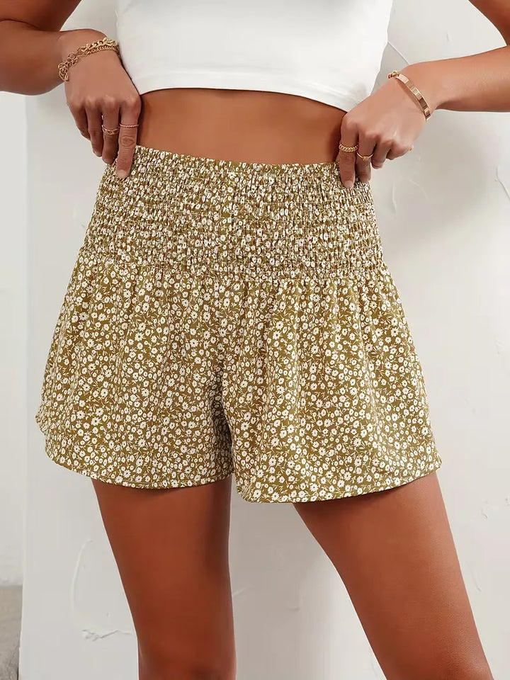 Hoge taille dames short met kleurrijke bloemenprint. Een must-have voor de vakantie.