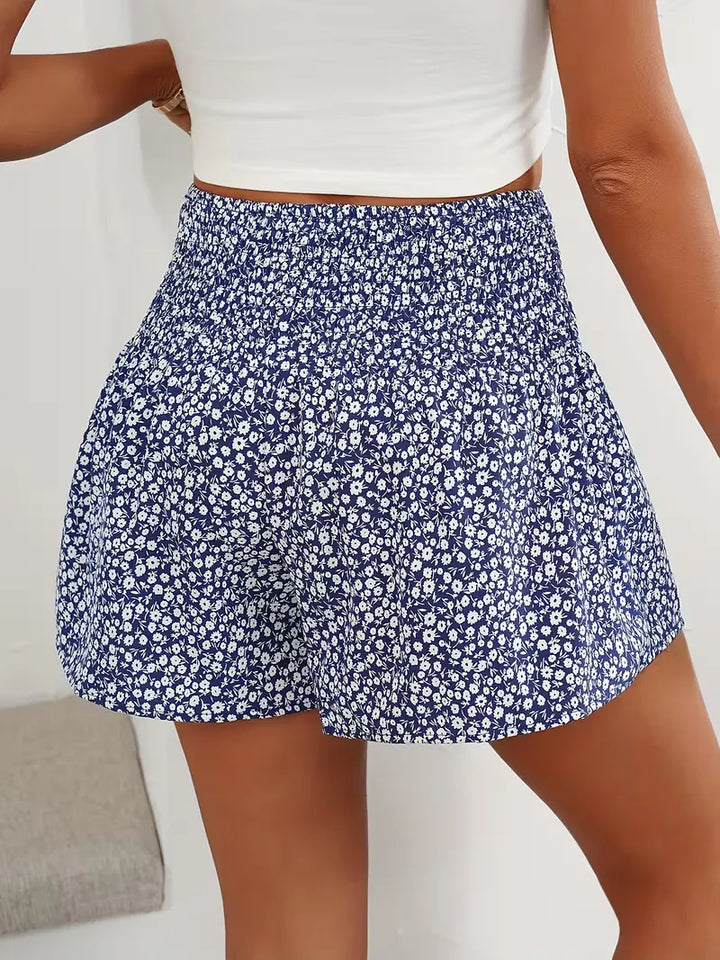 Stijlvolle dames short met bloemprint, hoge taille en wijde pijpen voor een relaxte look.