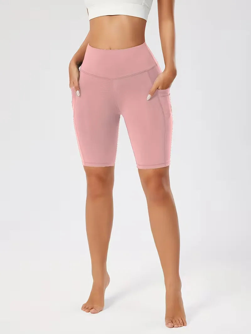 Dames high waist fitness shorts, slim fit, met zijzakken, voor optimale beweging.
