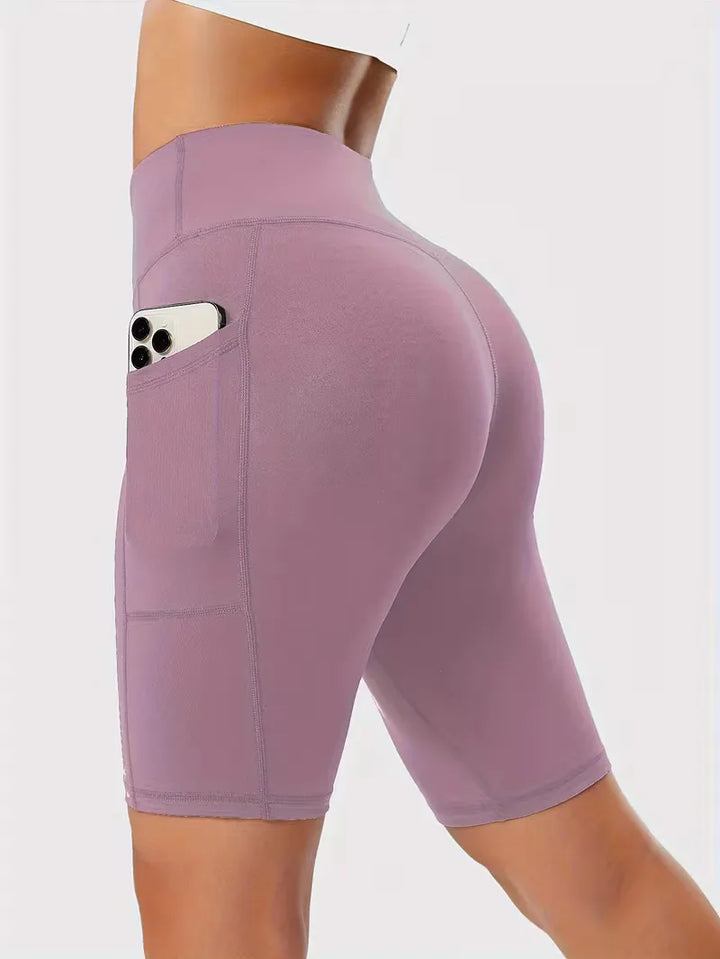 Dames high waist shorts met zakken, slim fit, ideaal voor yoga en fitness.