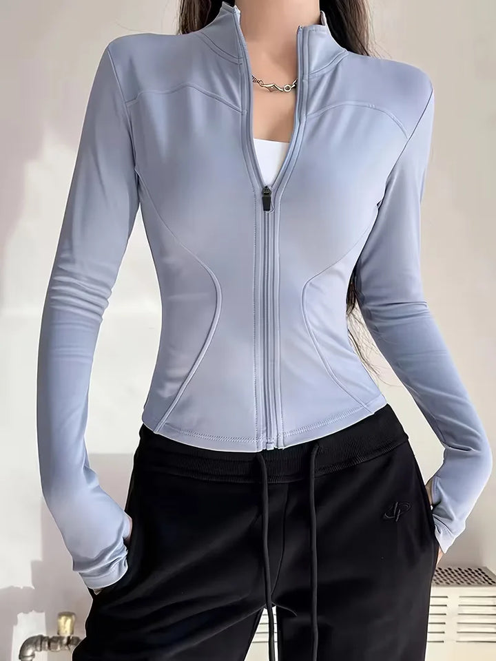Dames slim fit track jacket met duimgaten, perfect voor fitness & actieve casual look.