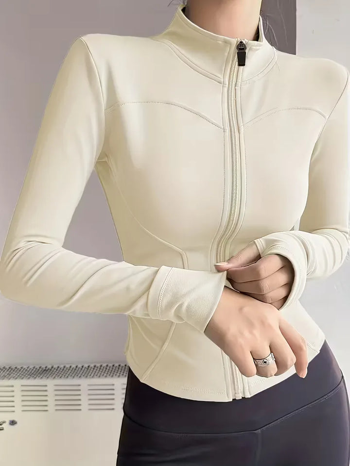 Witte dames slim fit track jacket, met duimgaten, voor een frisse look tijdens het sporten.