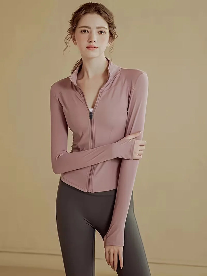 Dames slim fit trackjacket met rits en duimgaten, perfect voor lagen in lente/herfst.