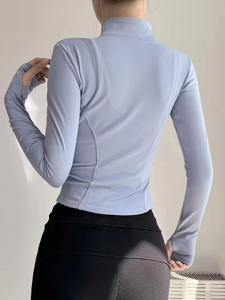 Sportieve dames trackjacket slim fit, met duimgaten en opstaande kraag voor herfst/lente.