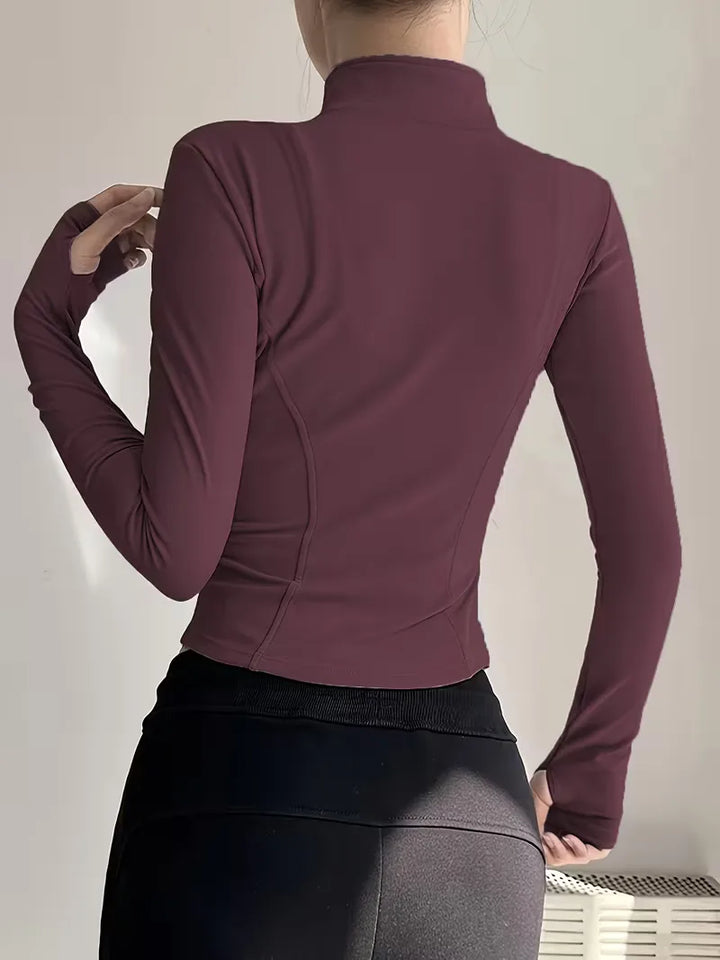 Lichtgewicht dames slim fit trackjacket met duimgaten, ideaal voor hardlopen en wandelen.