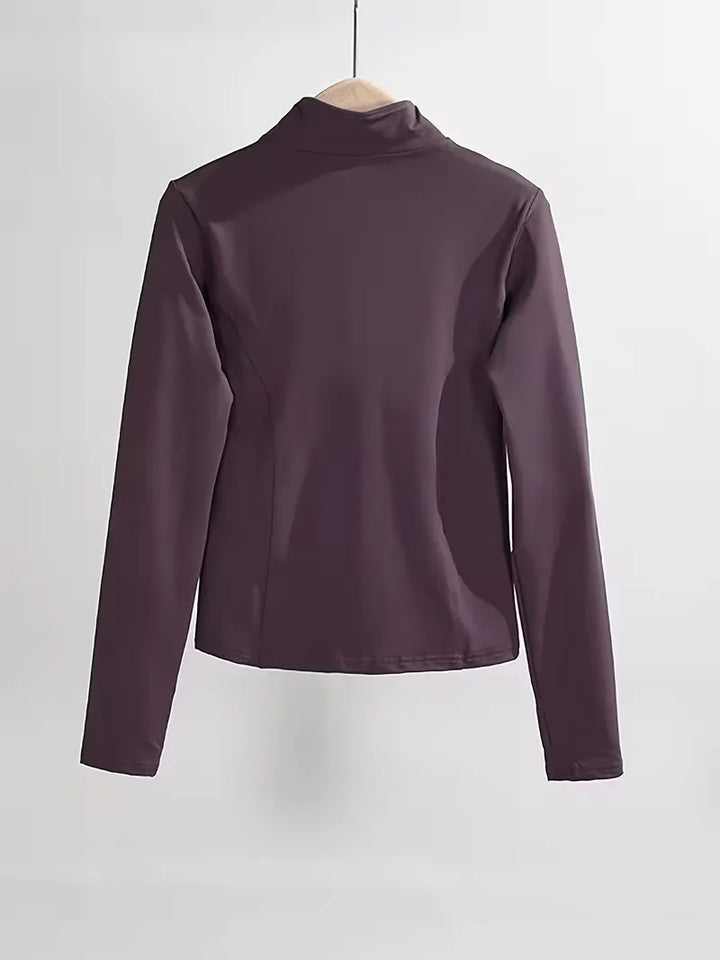 Warmhoudende dames track jacket slim fit, met duimgaten, ideaal voor koelere trainingsdagen.