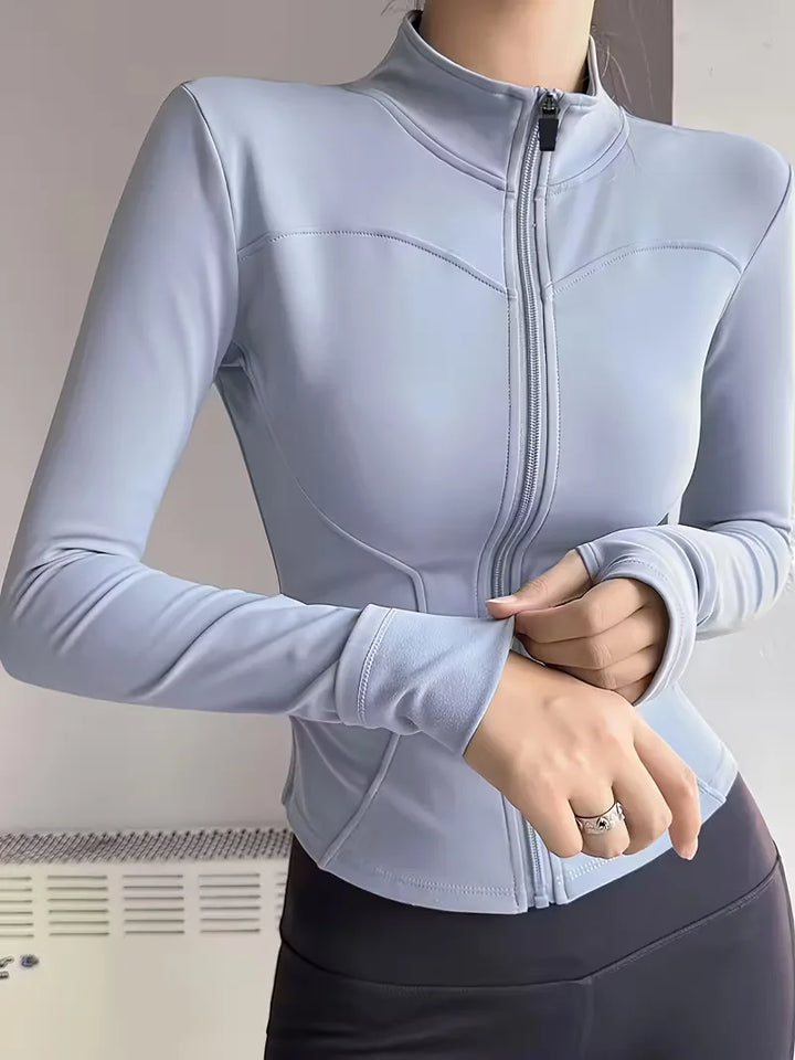 Activewear dames trackjacket slim fit, ideaal voor workout & casual met handige duimgaten.