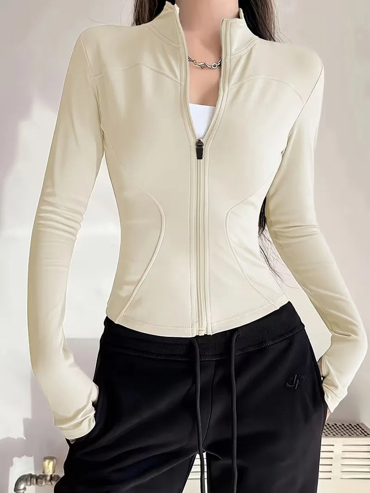 Blauwe dames trackjacket slim fit, met duimgaten, voor een dynamische en sportieve look.