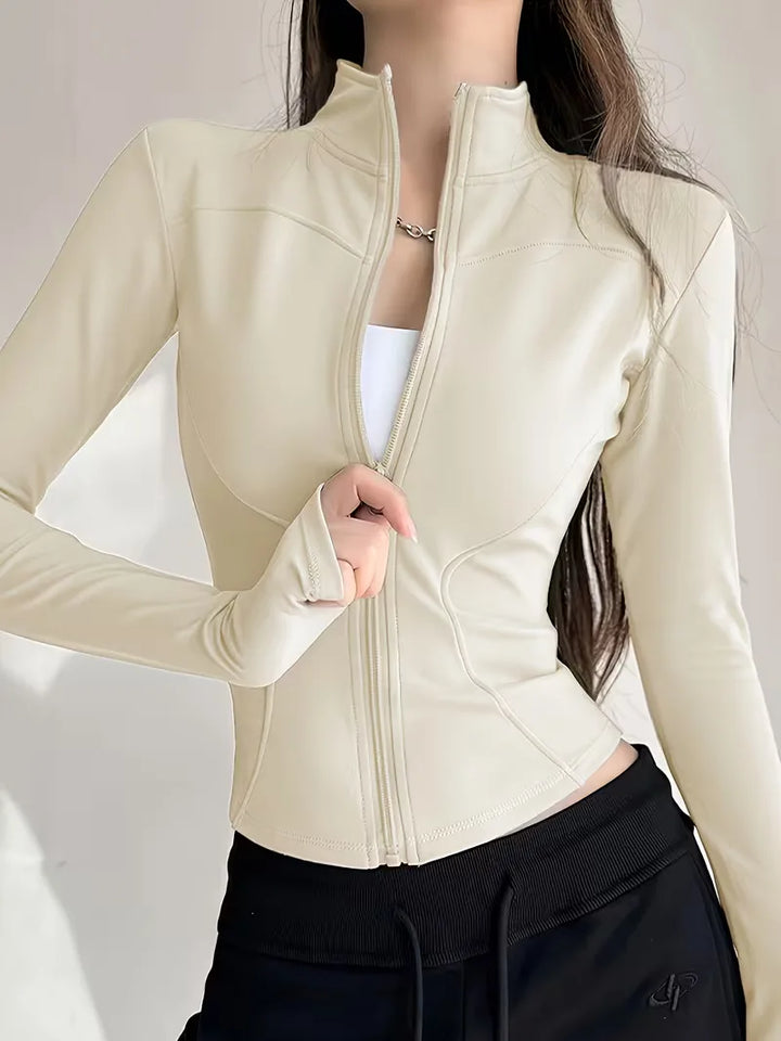 Roze dames activewear trackjacket slim fit, met duimgaten, stijlvol en functioneel.