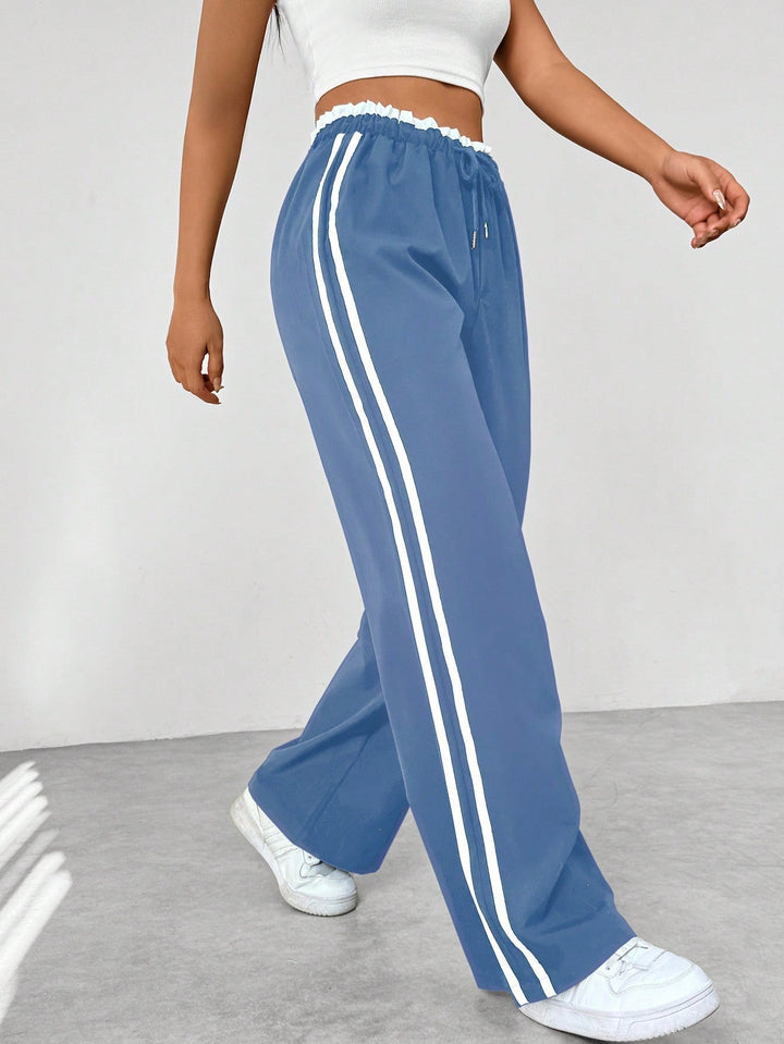 Dames sportieve wide-leg broek met trendy zijstrepen, ideaal voor een comfortabele casual look.