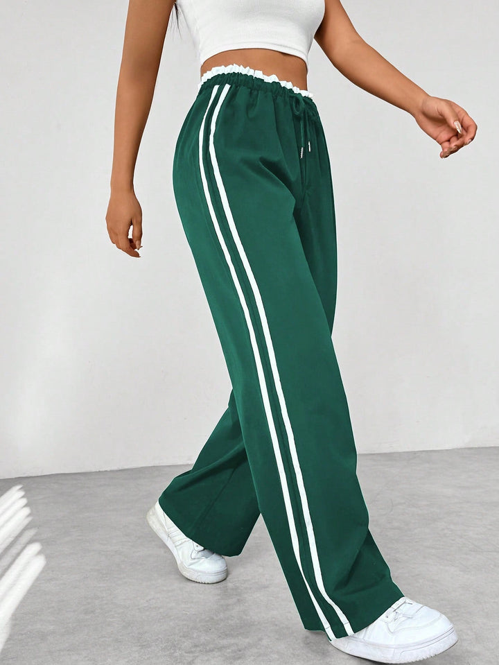 Sportieve dames wide-leg broek met strepen; veelzijdig voor zowel casual als trendy outfits.