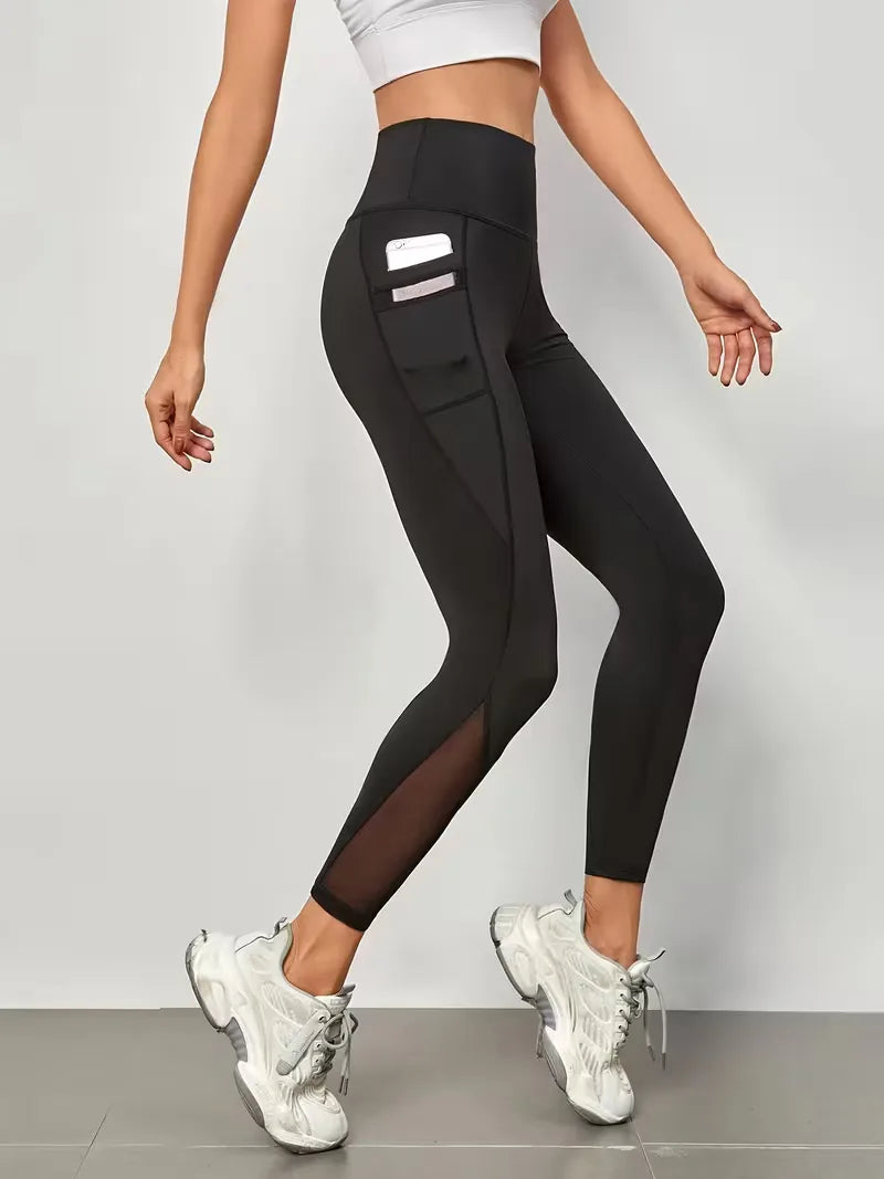 Stijlvolle athleisure legging voor dames, hoge taille, mesh panelen en zijzakken, comfortabel & modieus.