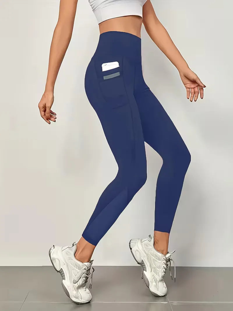 Veelzijdige dames legging, hoge taille, met mesh panelen en zijzakken, geschikt voor fitness en athleisure.