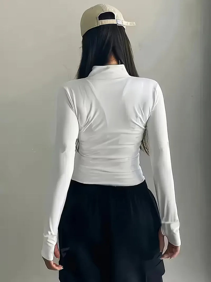 Multifunctionele dames sporttop met lange mouwen voor fitness, hardlopen en training.