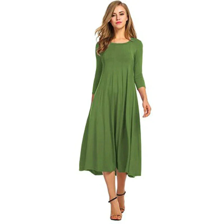 Chique midi zomerjurk voor dames, met driekwart mouwen. Modieus en comfortabel te dragen.