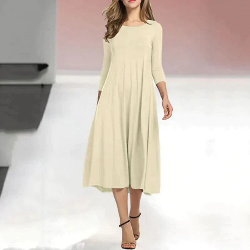 Modieuze dames midi jurk met driekwart mouw, perfect voor zomerse dagen en veelzijdig.