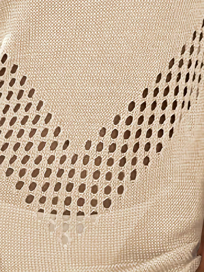 Mouwloze strandjurk dames met cut-out details, ideaal voor ontspanning aan het water.