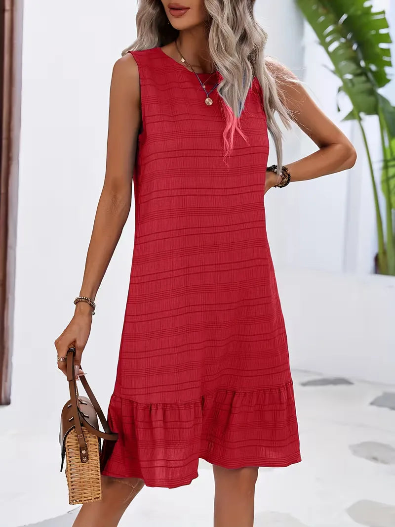 Losvallende mouwloze dames strandjurk, perfect als casual zomeroutfit met ruffled detail.