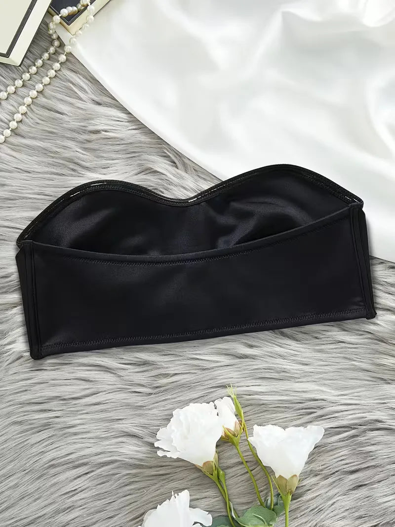 Stijlvolle zwarte dames bh, strapless met push-up en voorsluiting voor naadloze look.