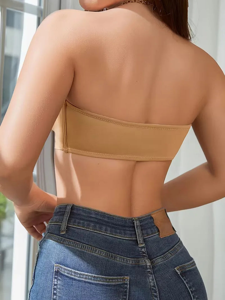 Zwarte strapless push-up bh, ontworpen met antislip functie en makkelijke voorsluiting.