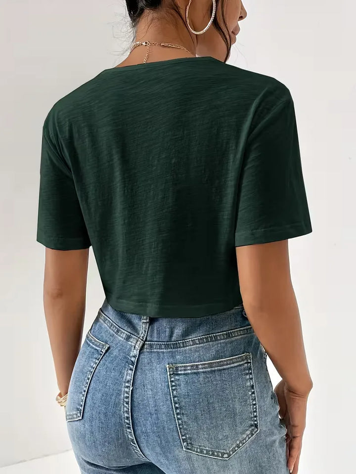 Wit dames T-shirt met opvallend twistdetail, voor een frisse en moderne uitstraling.