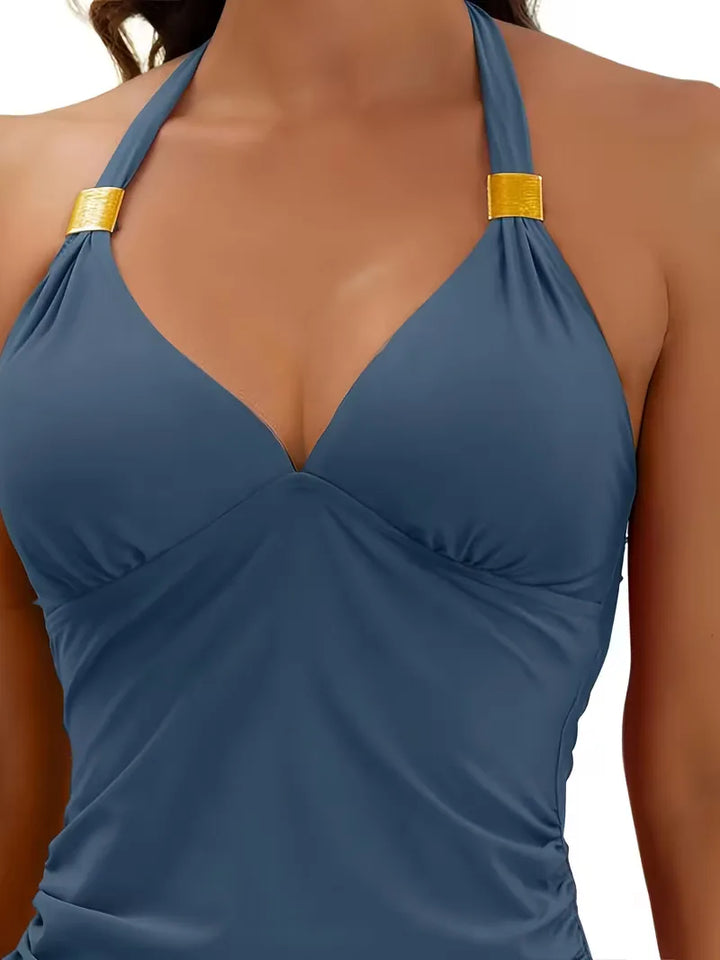 Elegante dames tankini zwempak met V-hals en halternek. Hoog getailleerd voor een mooie pasvorm.