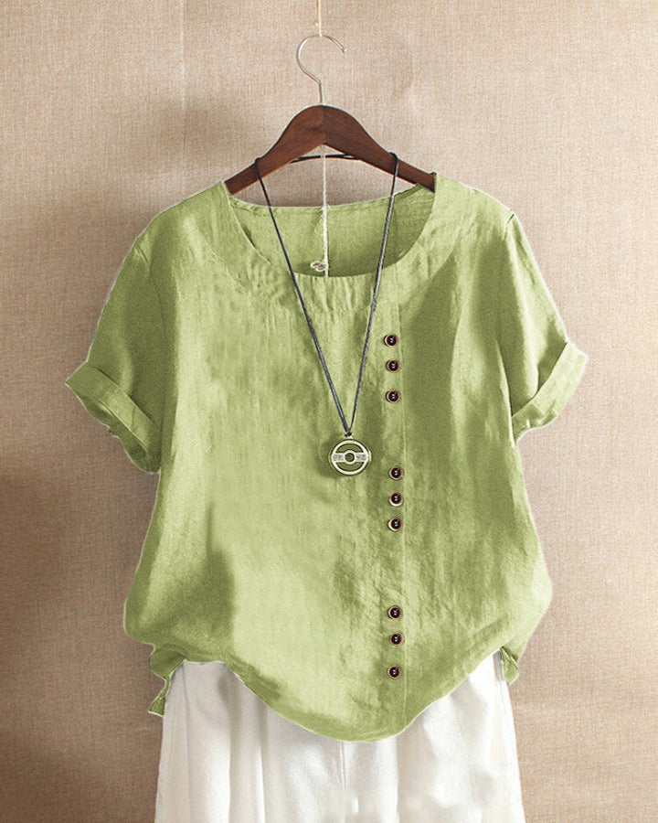 Elegante dames top met knoopjes en korte mouwen, perfect voor een casual chique look. Veelzijdig.