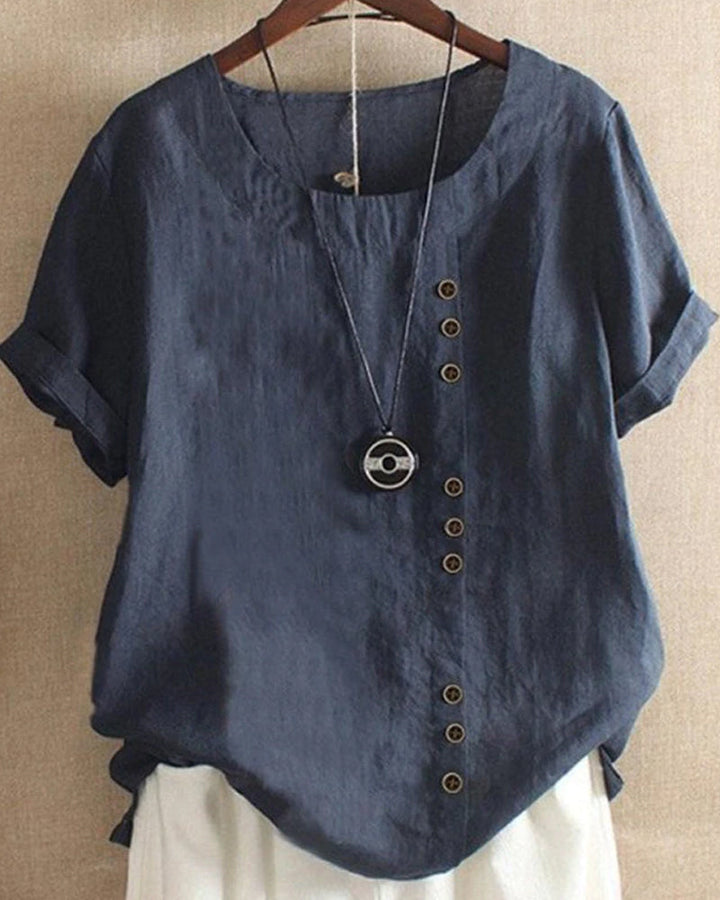 Zomerse dames top met korte mouwen en subtiele knoopdetails. Comfortabel en ademend materiaal.