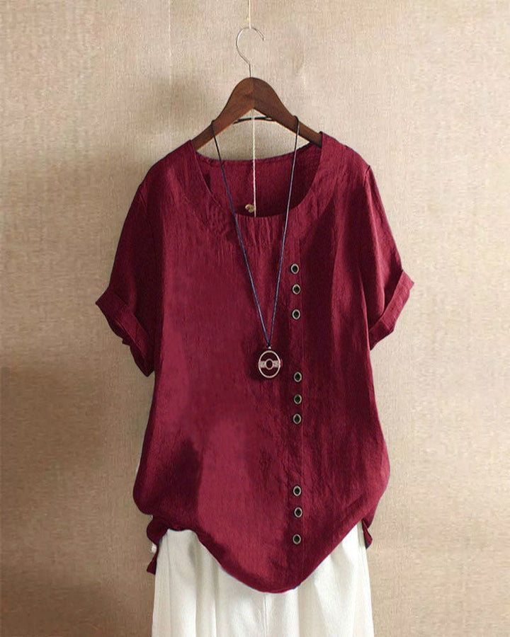 Elegante comfortabele dames top met korte mouwen en knoopjes. Perfect voor lente/zomer garderobe.