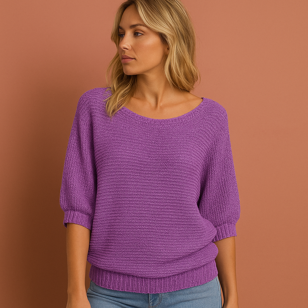 Zachte gebreide damestrui met verfijnde ruches, ideaal voor een stijlvolle en comfortabele casual look.