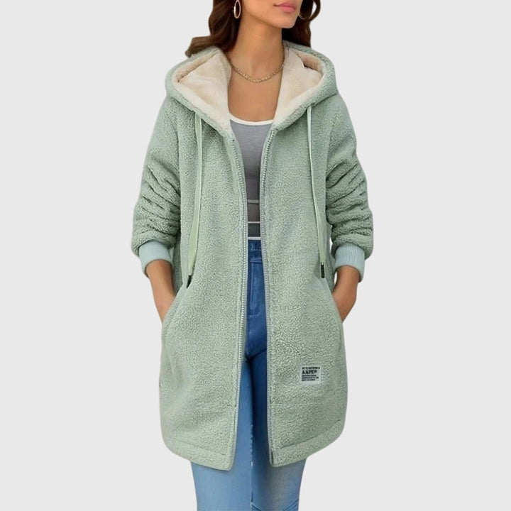 Elegante lange damesjas met capuchon, ritssluiting en warme voering. Perfecte herfst/winter casual jas.