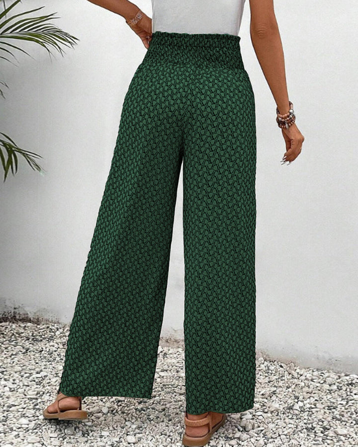 Damesbroek met wijde pijpen en fris geometrisch patroon, comfortabel en modieus, perfect als zomerbroek.