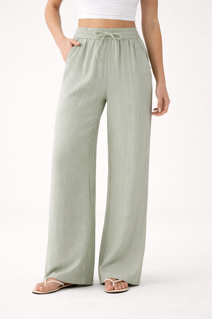 Dames wijde zomerbroek met comfortabele elastische taille en trekkoord, ideaal voor strand of vrije tijd.