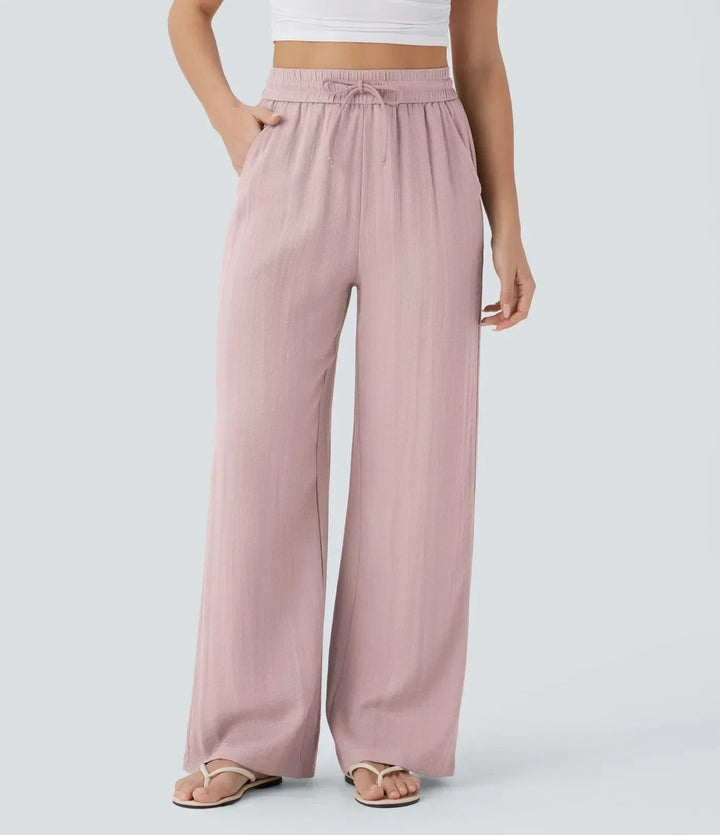 Dames zomerbroek met wijde pijpen en trekkoord, perfect te combineren voor een comfortabele, casual outfit.