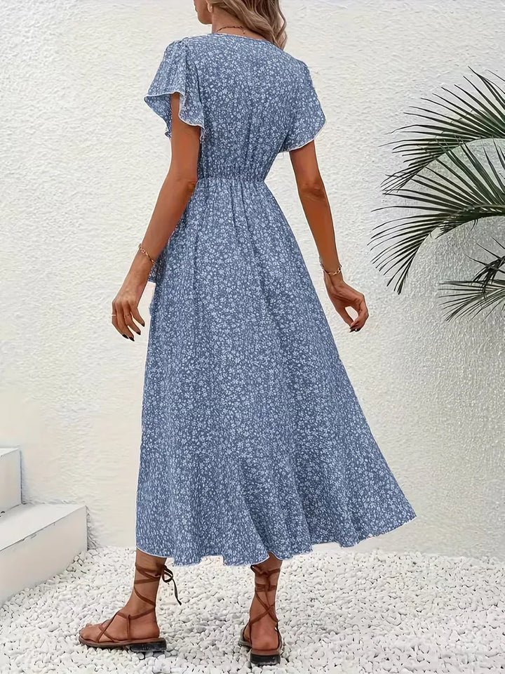 Zomerse midi wikkeljurk voor dames met elegante bloemenprint en v-hals.