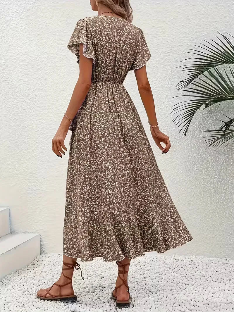 Midi wikkeljurk voor dames met bloemenprint, V-hals en zomerse korte mouwen.