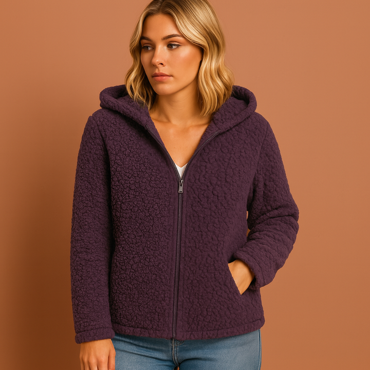 Blauw dames vest met rits en capuchon, een warme en veelzijdige winterjas voor de koude dagen.