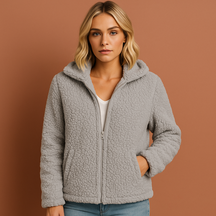 Dames winterjas met capuchon, comfortabel vest met rits in grijs, warm en tijdloos design.