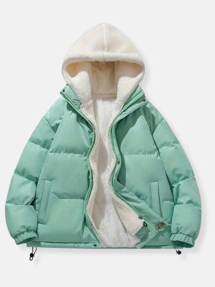 Subtiel merklogo op de mouw van deze stijlvolle dames winterjas, Steppjacke.