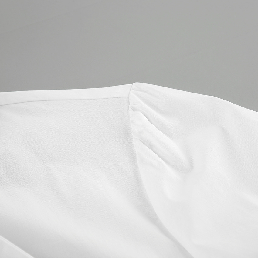Dameskleding: witte strikblouse, elegante en modieuze top met lange mouw. Perfect voor werk.