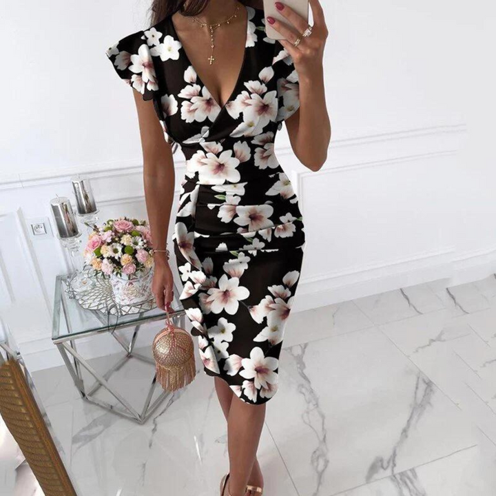 Dames zomerjurk met diepe V-hals en stijlvolle aangerimpelde mouwen, perfect voor casual dagen.